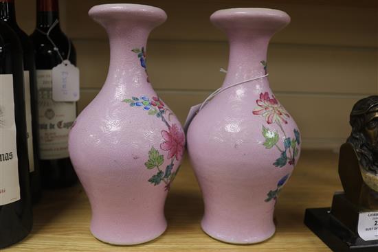 A pair of Chinese pink sgraffito ground famille rose vases